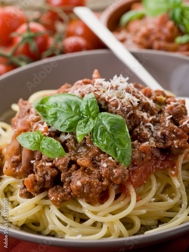spaghetti bolognese with ragout sauce and parmesan cheese