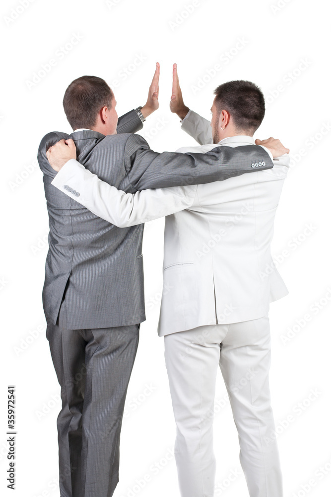 Two joyful businessmen with success gesture . Rear view. Two joyful businessmen with success gesture . Rear view.