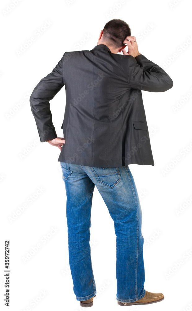 Fototapeta premium thinking businessman. Rear view.