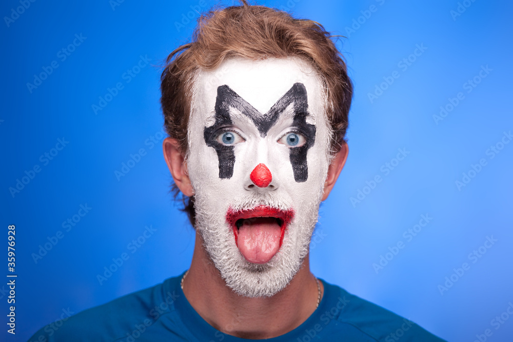 A man with clown makeup on his face