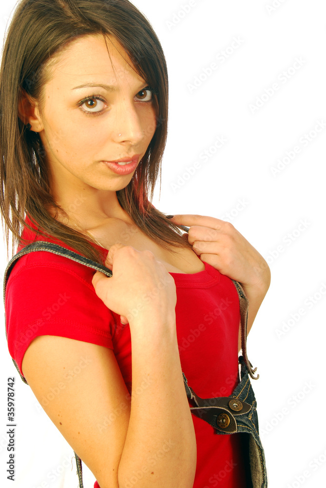Beautiful brunette with overalls and red T-shirt Beautiful brunette with overalls and red T-shirt