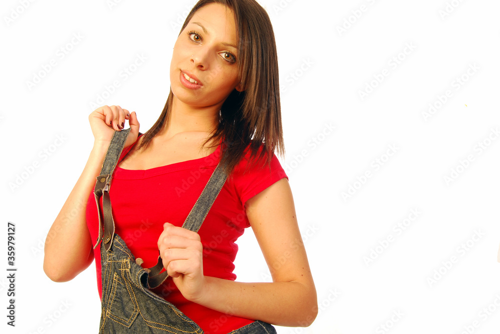 Beautiful brunette with overalls and red T-shirt Beautiful brunette with overalls and red T-shirt