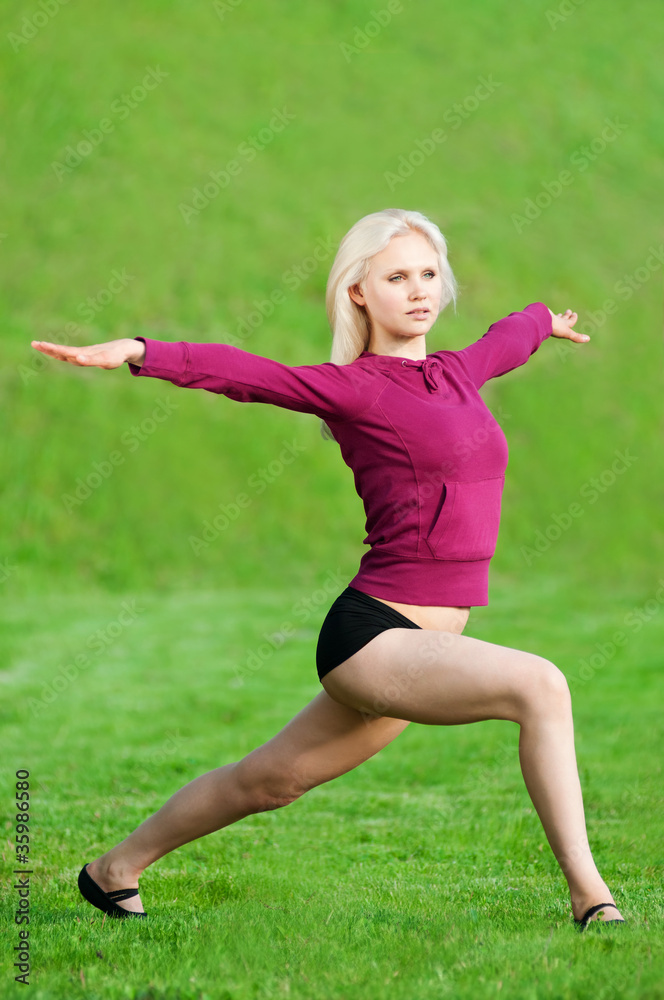 Beautiful woman doing yoga stretching exercise