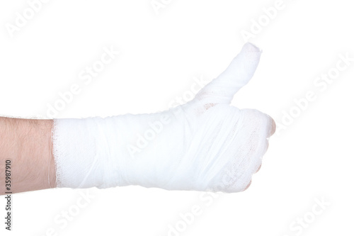 Bandaged hand isolated on white © Africa Studio