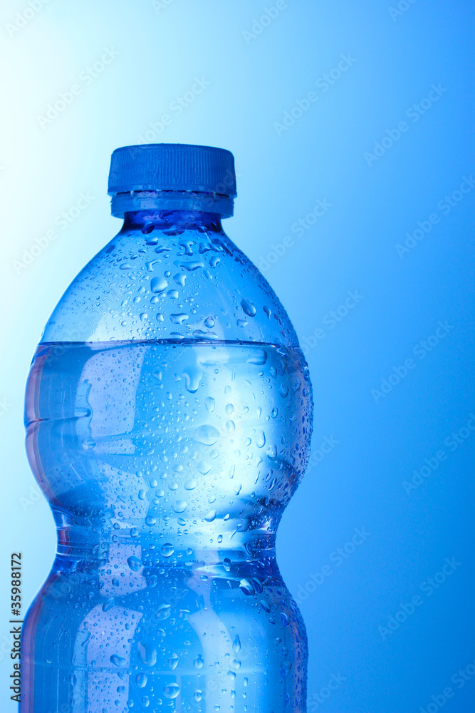 Plastic bottle of water on blue background Plastic bottle of water on blue background