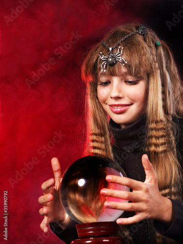 Child  holding crystal ball.
