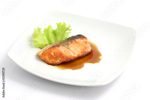 grilled salmon with teriyaki sauce isolated in white background