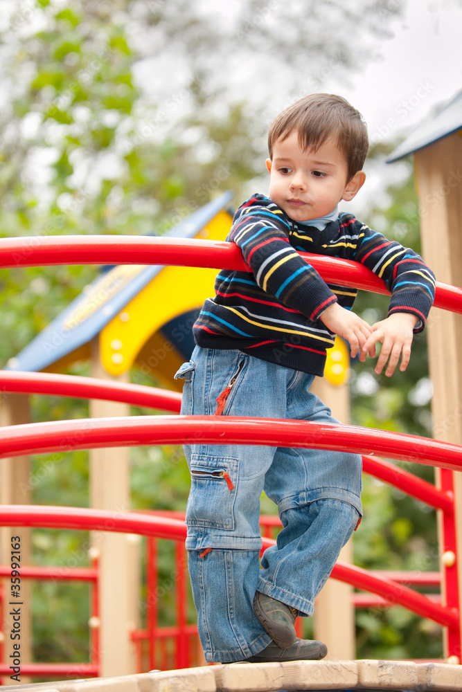 Thoughtful boy on the playground Thoughtful boy on the playground