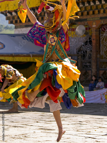 Bhutan - October 2010: Masked man are dancing on a tsechus (Bhut photo