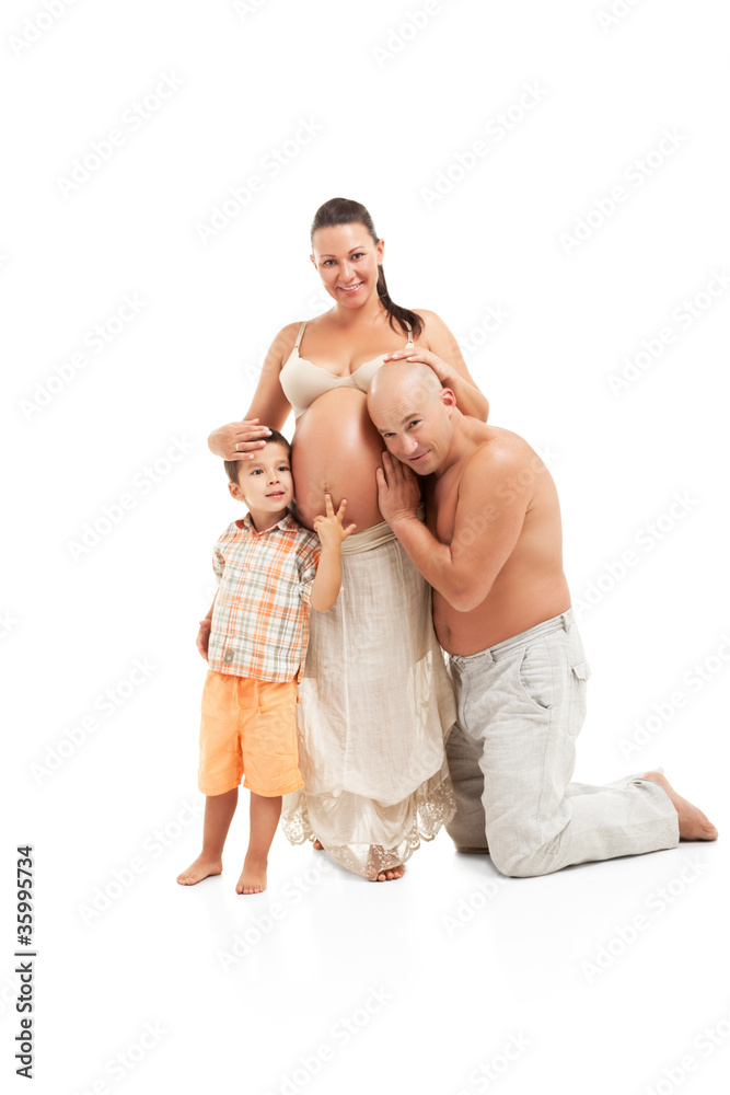 Happy pregnant woman with her boy and husband