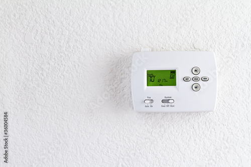 digital thermostat on white wall