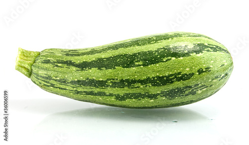 Green zucchini isolated on white