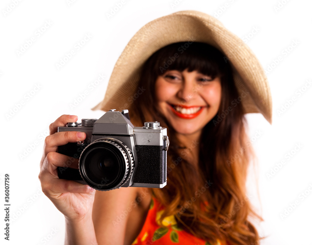 Young woman with old camera, smiling taking photos Young woman with old camera, smiling taking photos