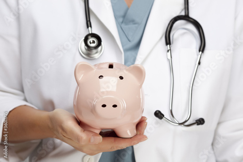 Doctor with Stethoscope Holding Piggy Bank Abstract