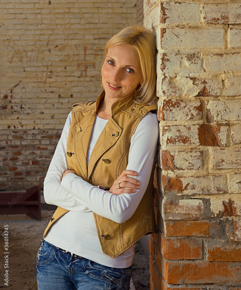 woman at the brick wall