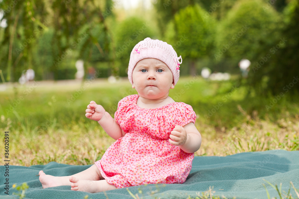 Summer portrait of beautiful baby on the lawn Summer portrait of beautiful baby on the lawn