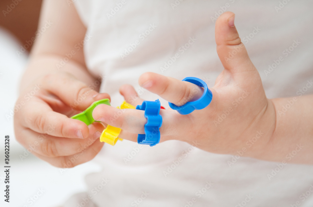 Baby's hands with toys Baby's hands with toys