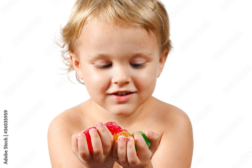 Little boy with colored jelly candies on white background Little boy with colored jelly candies on white background