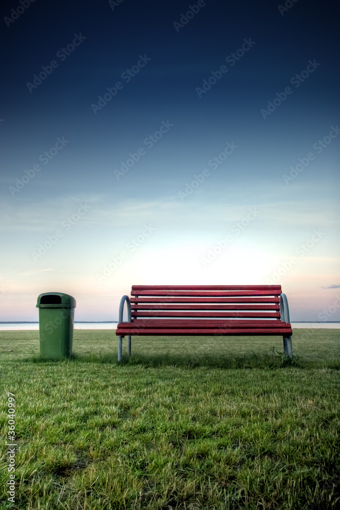 Fototapeta premium Bench in the park at the seashore