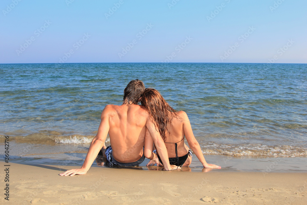 Portrait of happy couple on the beach Portrait of happy couple on the beach