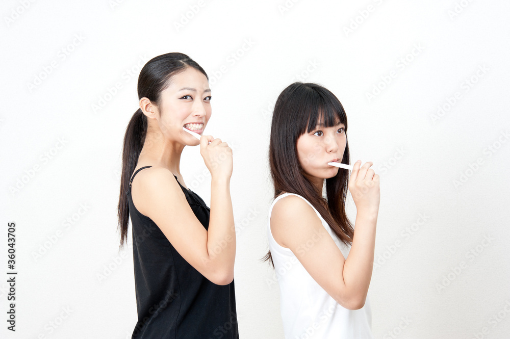 attractive asian women brushing her teeth attractive asian women brushing her teeth