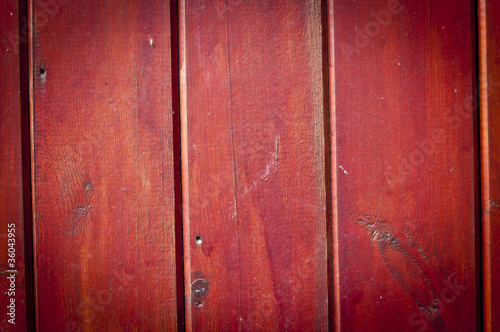 Red stained wooden boards