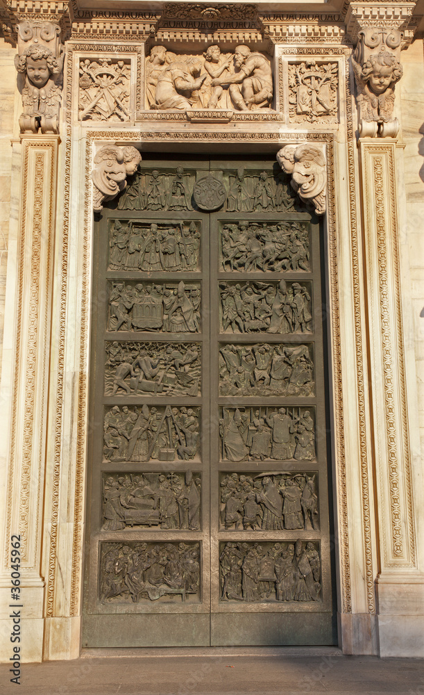 Milan - side bronze gate of Duomo cathedral
