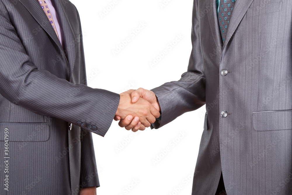 Two businessmen hands handshake isolated over white Two businessmen hands handshake isolated over white