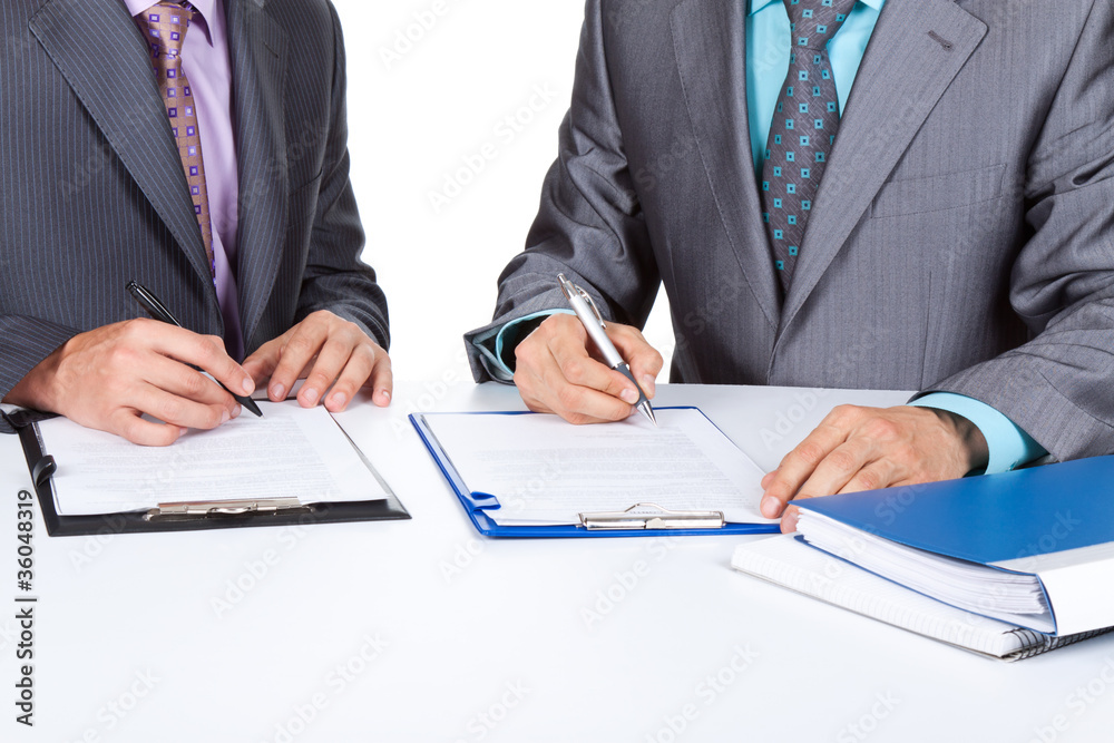 Two business people working with documents sign up contract Two business people working with documents sign up contract
