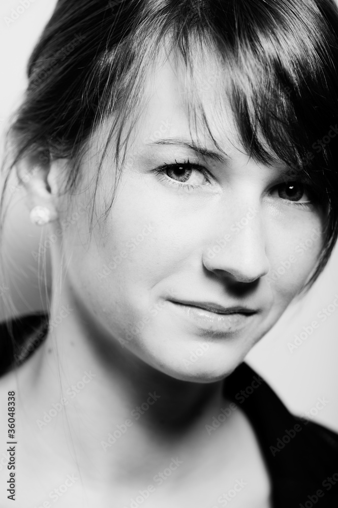 Black and white portrait of young smiling woman Black and white portrait of young smiling woman