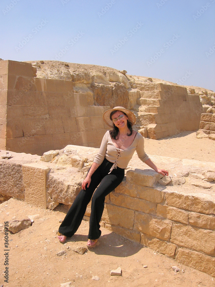 Beautiful young tourist woman in ruins in Egypt