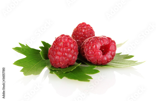 beautiful raspberries and leaves isolated on white