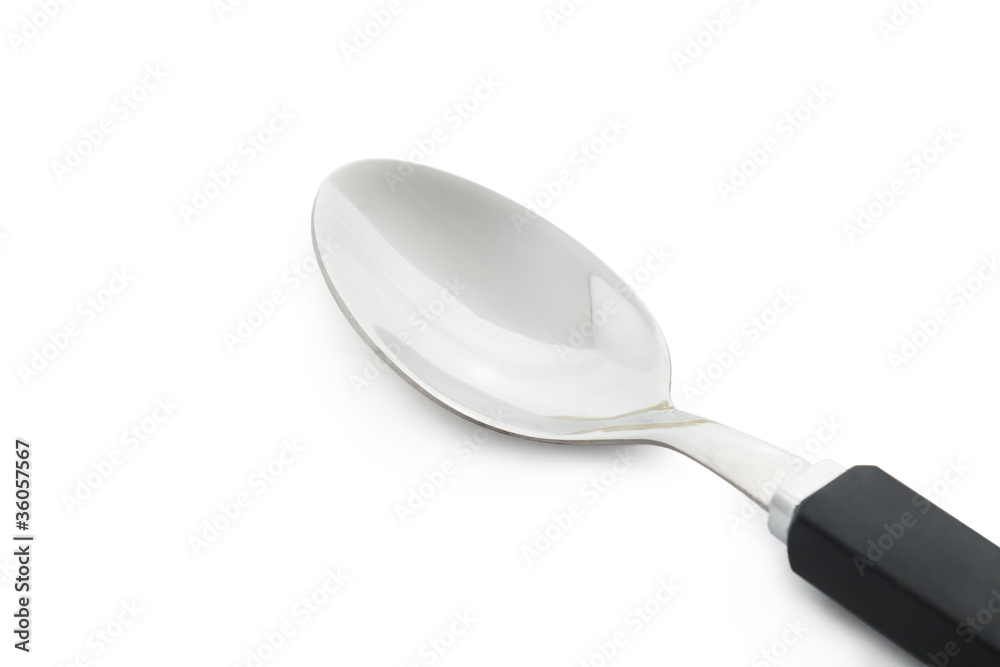 closeup steel spoon isolated on white background closeup steel spoon isolated on white background