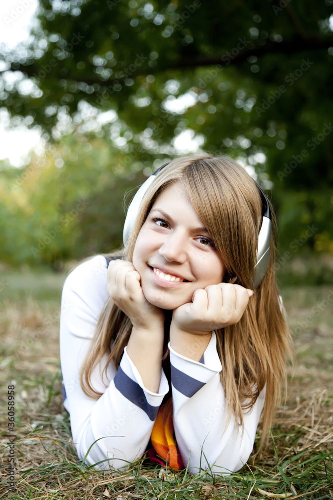 Portrait of girl with headphones at outdoor. Portrait of girl with headphones at outdoor.