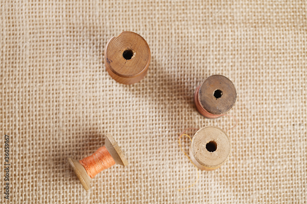 real old reels spoons with color treads on old wood real old reels spoons with color treads on old wood