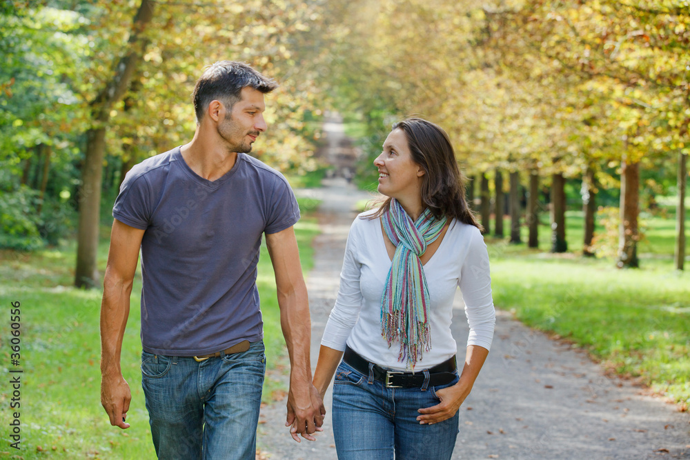 Young Couple Walking in autumn park Young Couple Walking in autumn park