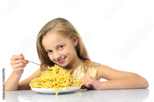 little girl eating spaghetti