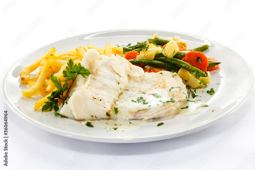 Fish dish - fish fillet, French fries and vegetables Fish dish - fish fillet, French fries and vegetables