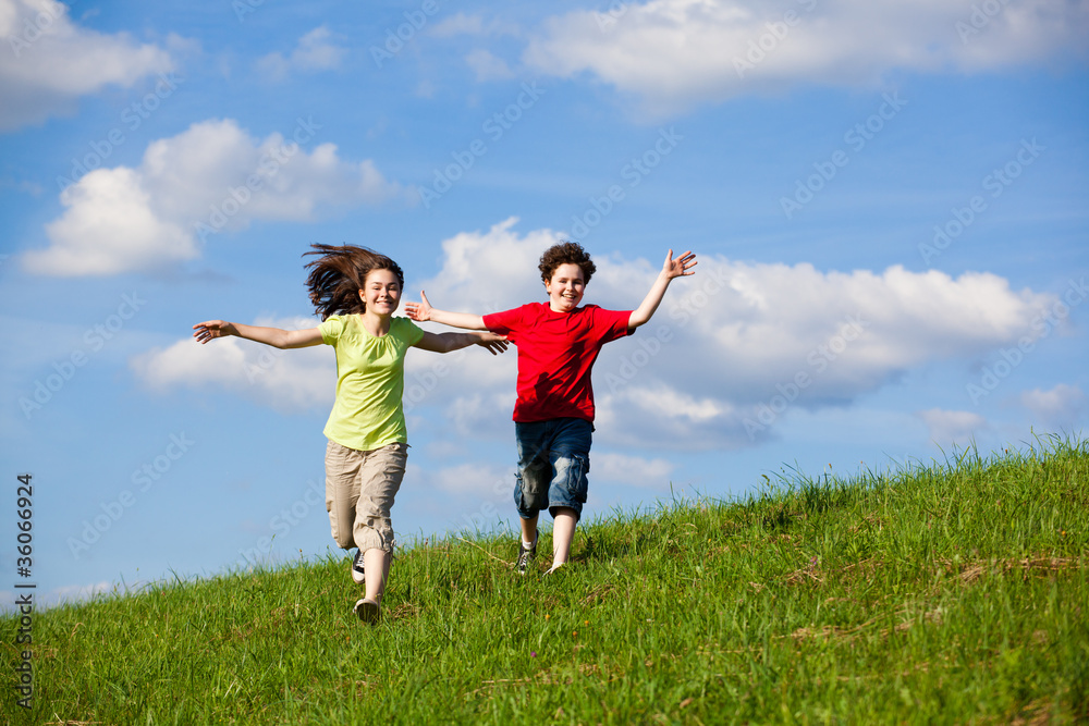 Girl and boy running, jumping outdoor Girl and boy running, jumping outdoor