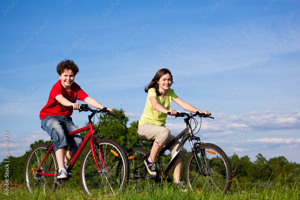 Girl and boy cycling