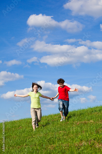 Girl and boy running  jumping outdoor