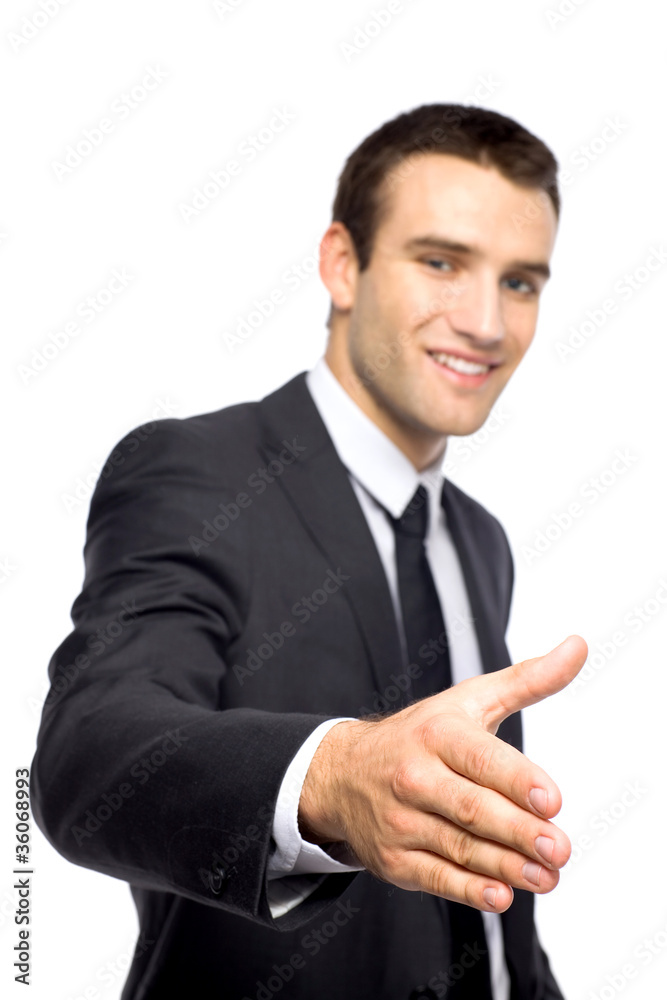 Businessman extending his hand for a handshake Businessman extending his hand for a handshake