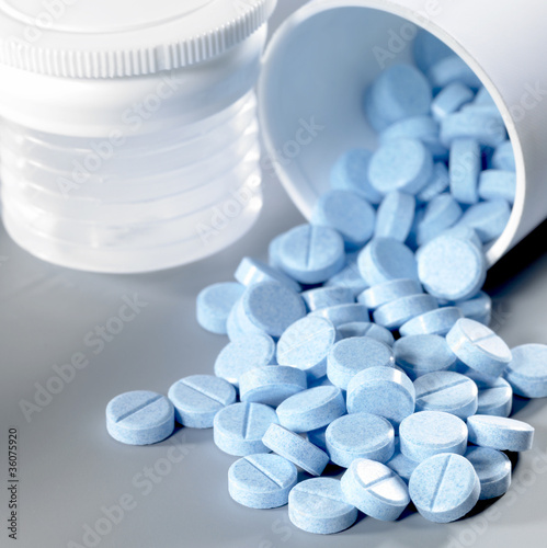blue pills fallen out of the box
