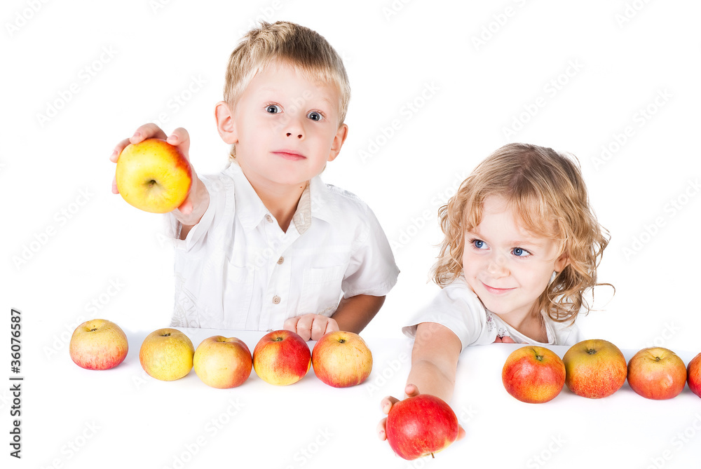 Two kids offering apples isolated on white background Two kids offering apples isolated on white background