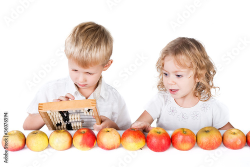 Two kids counting apples isolated on white background