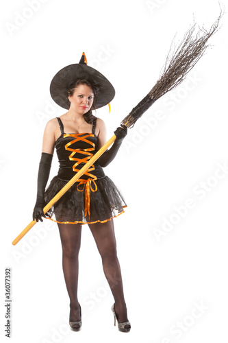 sexy girl in Halloween witch with broom photo