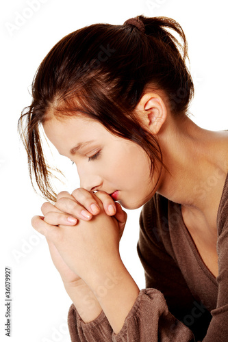 Pretty girl praying. photo