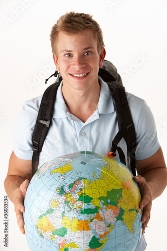 Young traveller with globe photo