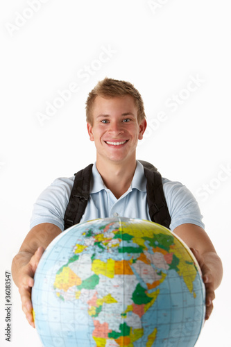 Young traveller with globe photo