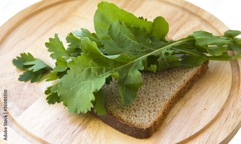 Rigid diet. A piece of rye bread with salad and parsley